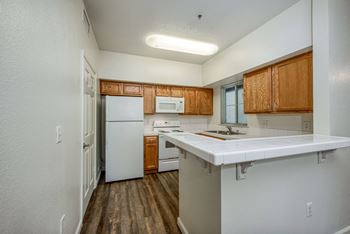 U Shape Kitchen - window  - Refrigerator - Dishwasher - Range - above range Microwave - Wood plank floors - Pantry Closet